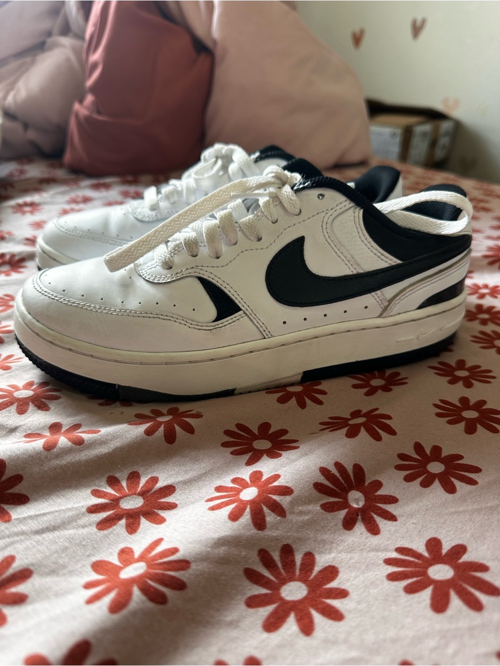 Nike women’s White and Black Low-Top Sneakers with Black Swoosh